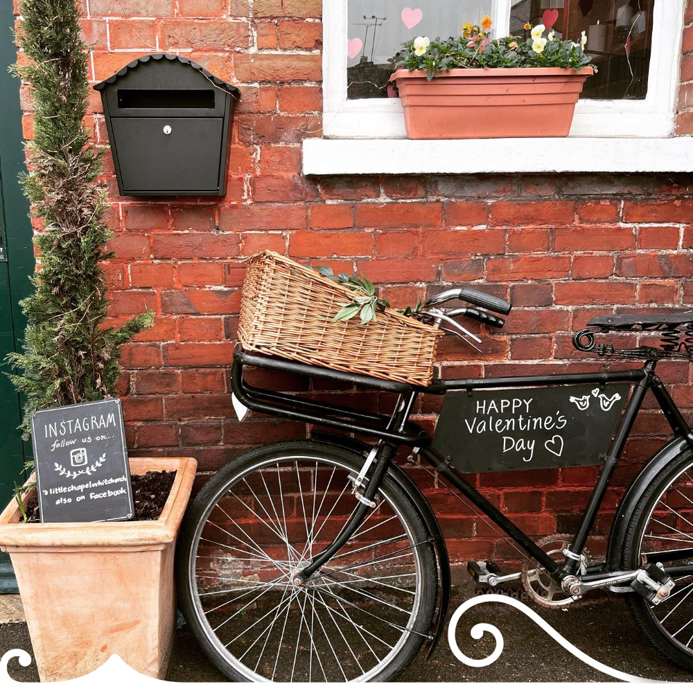 Bicycle Leaning Against The Front Of The Little Chapel