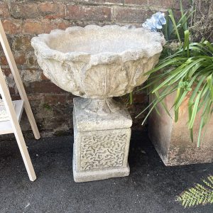 Pair of Urns with pedestals and acanthus leaf designs